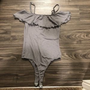 A cute grey bodysuit with removable straps